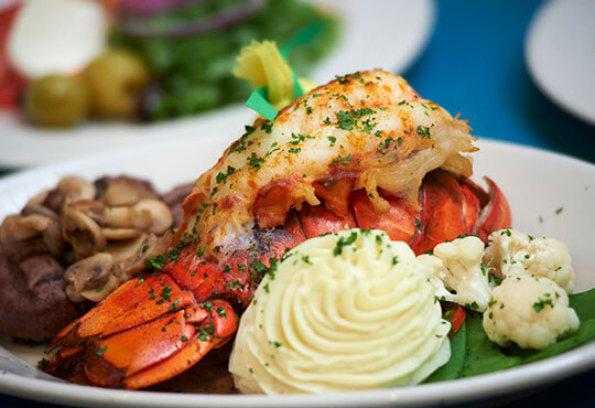 Fresh cooked lobster with mushrooms, mashed potatoes and cauliflower.