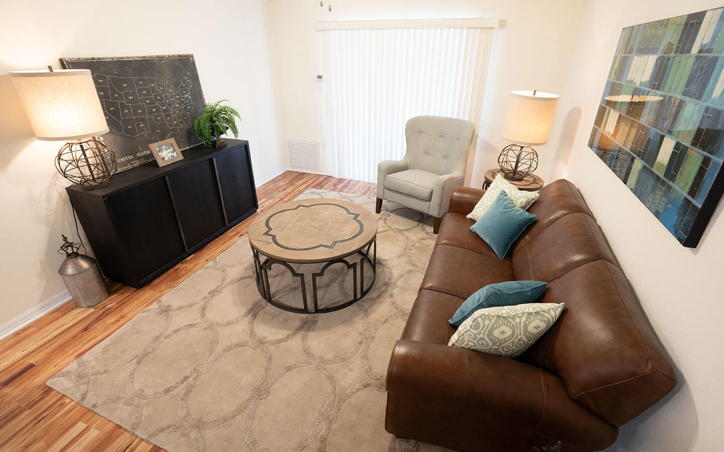 Living room with couch, winged chair and coffee table