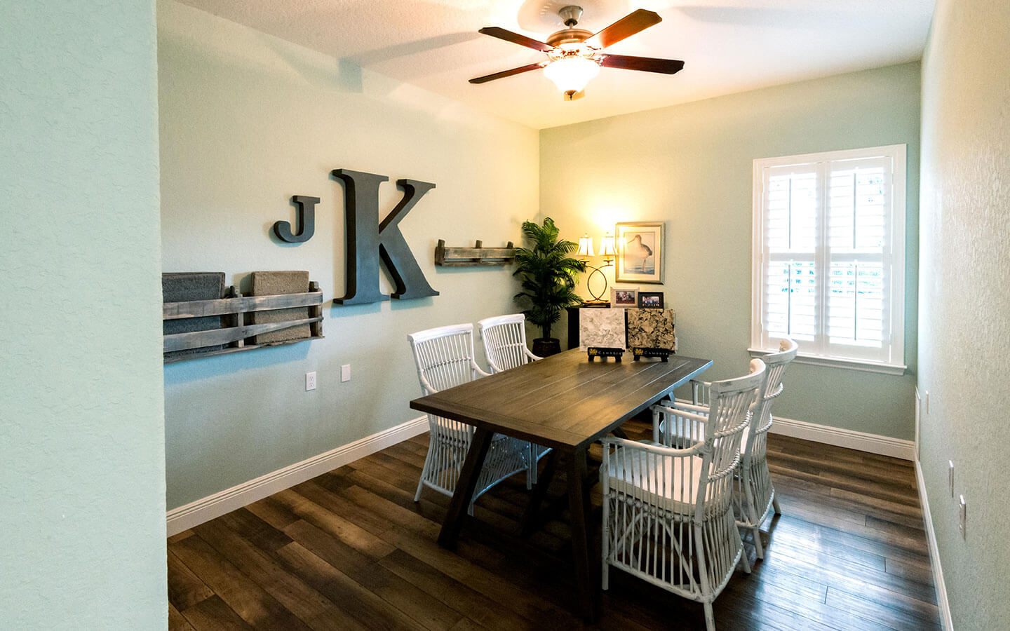 Large dining room with table and chairs.